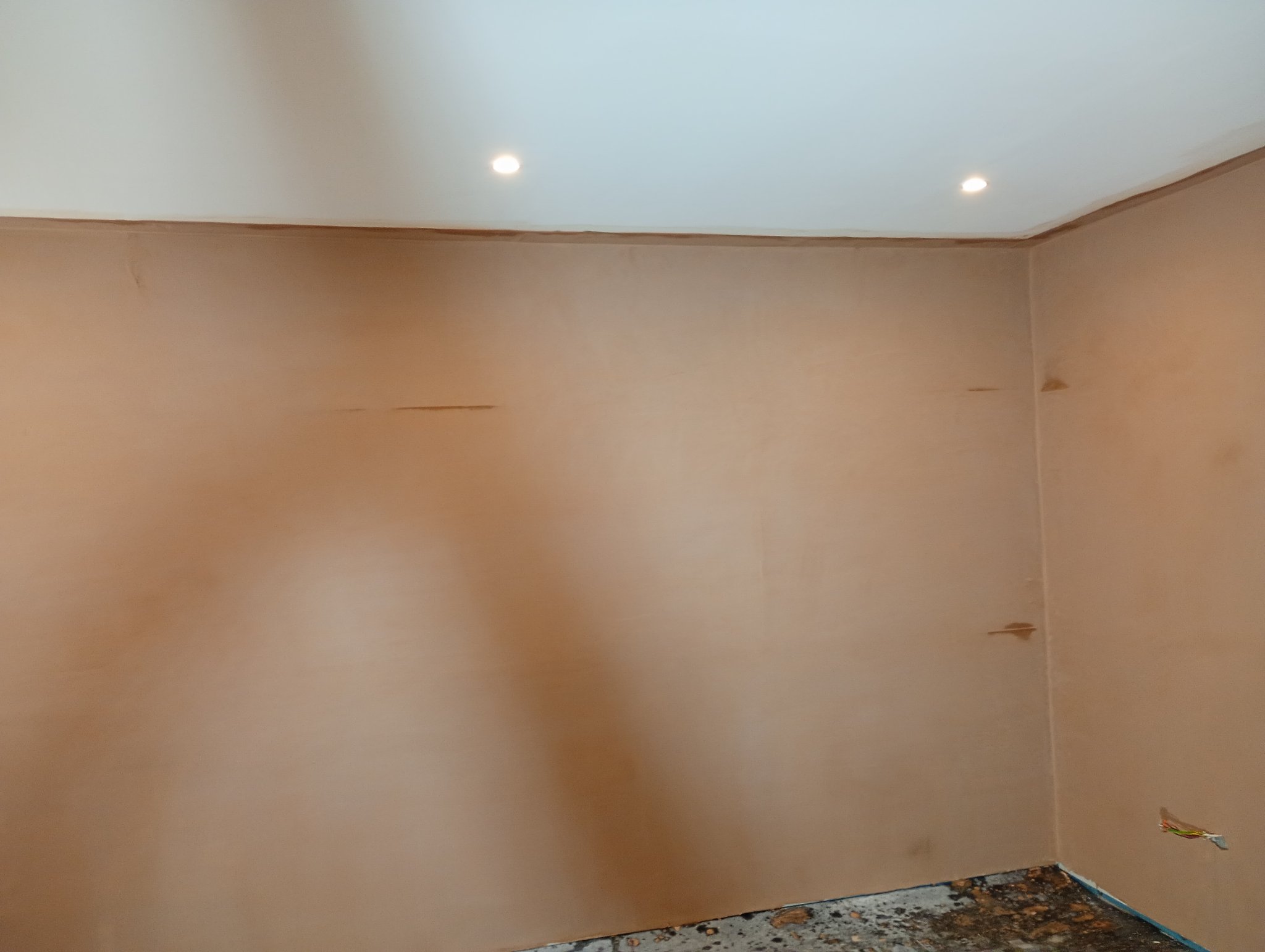 Finished plaster skim across the basement walls in Margate